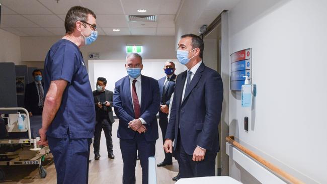 Premier Steven Marshall, right, and Health Minister Stephen Wade talk to Nurse Unit Manager Martyn Cox at Modbury Hospital. Picture: Brenton Edwards