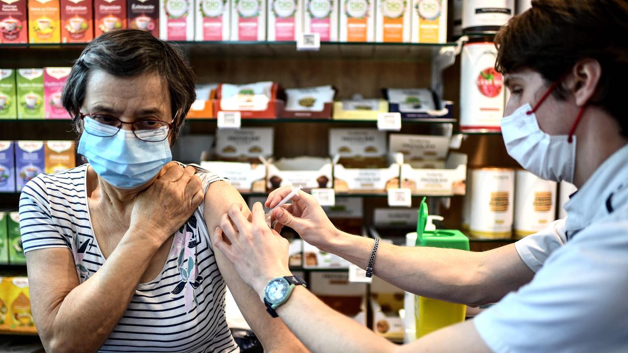 A woman receives a Covid vaccine in France. (Photo by Christophe ARCHAMBAULT / AFP)