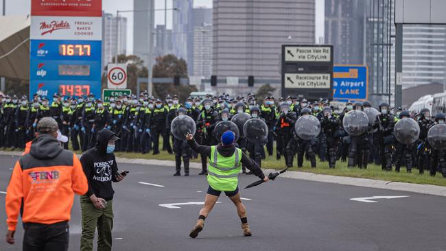 Riot police prepare for the approaching rally. Picture: Jason Edwards