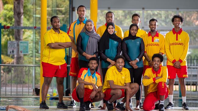 Abdisamad (on the far left), Hanad (standing with blue collar) and Saeed (kneeling with blue collar) have all been employed at the Maribyrnong Aquatic Centre. Picture: Jay Town