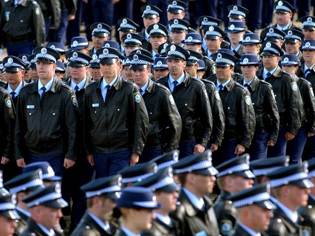 In a file image taken Canberra, August 30, 2002, shows graduating police constables during the graduation parade at the NSW Police Academy in Goulburn. (AAP Image/Alan Porritt) NO ARCHIVING