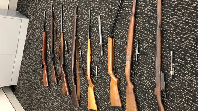 Some of the dozens of guns seized by Gold Coast police.