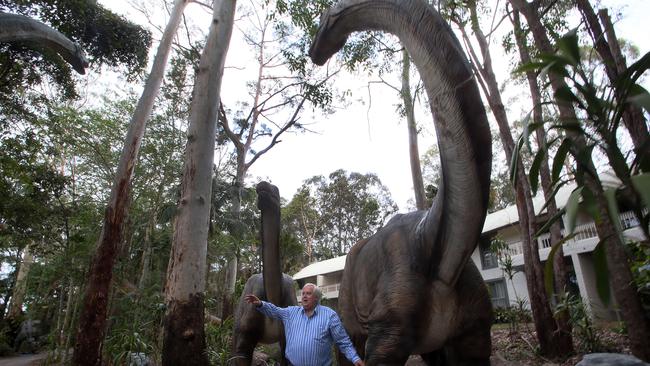 Clive Palmer with one of his dinosaurs at the Coolum Resort in 2013. Picture: Glenn Barnes.