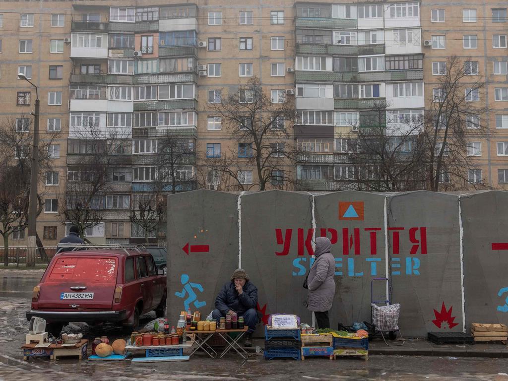 People sell vegetables and other goods next to a bomb shelter at a market in Kramatorsk, Donetsk region. Picture: AFP