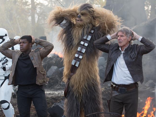 We’ve played this scene before ... Finn, played by John Boyega, with Chewbacca and Han Solo in a scene from the new movie. Picture: Lucasfilm