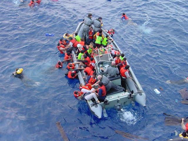 TAUS 60th Anniversary. 08-10-2001 - Crew of the HMAS Adelaide rescue asylum seekers fleeing the sinking ship SIEV 4, which had been intercepted on approach to Christmas Island. Picture: HMAS Adelaide