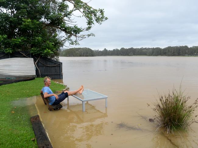 Narrabeen local Rohan Cudmore wakes to see the water levels rise and flood his back yard in Lagoon St, Narrabeen, in December 2020. Picture: Jeremy Piper