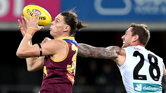 Eric Hipwood attempts to mark before suffering a serious knee injury. Picture: Getty Images