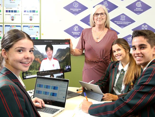 With Kathleen Power - Director of International Education, with overseas student online Ota Haibara 17yrs (Japan) with fellow students L to R, Jessica Spiller 16yrs, Annabelle Milner 16yrs, Arinesh Prasad 16yrs, international students are logging in from overseas to continue their schooling at St Paul's School Bald Hills, despite covid keeping them offshore, on Wednesday April 14th 2021 - Photo Steve Pohlner