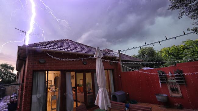 Lightning over a Canterbury home during the storms. Picture: Alex Coppel