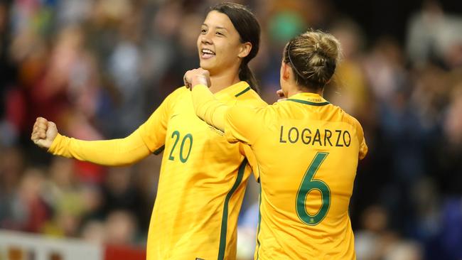 Sam Kerr and Chloe Logarzo celebrate scoring against Brazil.