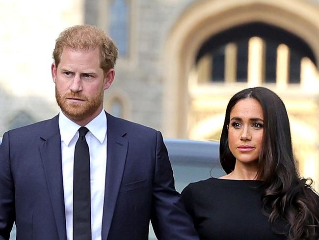 WINDSOR, ENGLAND - SEPTEMBER 10: Prince Harry, Duke of Sussex, and Meghan, Duchess of Sussex on the long Walk at Windsor Castle arrive to view flowers and tributes to HM Queen Elizabeth on September 10, 2022 in Windsor, England. Crowds have gathered and tributes left at the gates of Windsor Castle to Queen Elizabeth II, who died at Balmoral Castle on 8 September, 2022. (Photo by Chris Jackson/Getty Images)