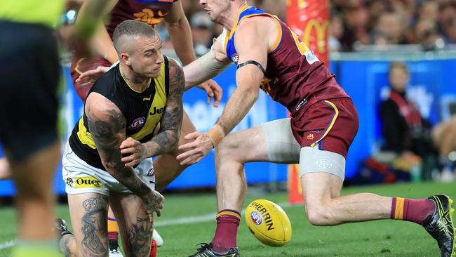 Dustin Martin throws the ball away in an act that lead to a Jack Riewoldt goal. Picture: Adam Head