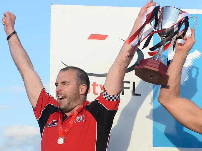 Brett Moyle lifts the 2014 Division 2 premiership cup. Picture: Susan Windmiller