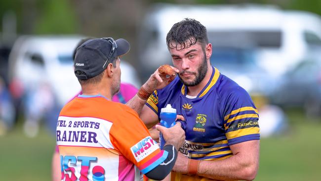 Owen Brock receives treatment after a poke in the eye. Picture: DC Sports Photography