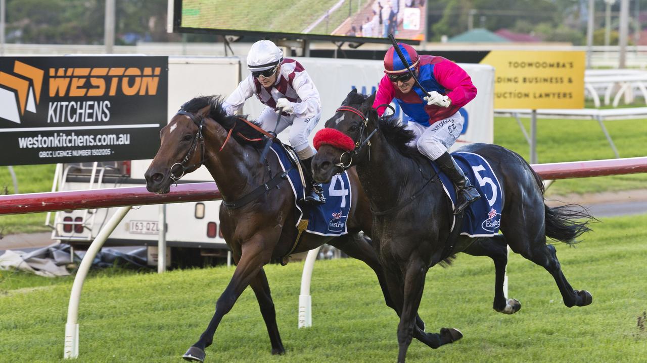 Jockey Brad Pengelly and Line Up (outside) arrive on the line to down Accumulated (Skye Bogenhuber) in today’s Class 2 Handicap at Clifford Park. Picture: Kevin Farmer