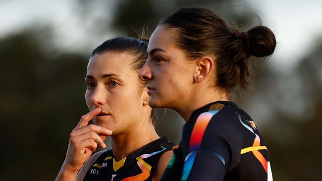 MELBOURNE, AUSTRALIA - OCTOBER 19: Kate Dempsey (left) and Monique Conti of the Tigers look dejected after a loss during the 2024 AFLW Round 08 match between the Melbourne Demons and the Richmond Tigers at Casey Fields on October 19, 2024 in Melbourne, Australia. (Photo by Michael Willson/AFL Photos via Getty Images)