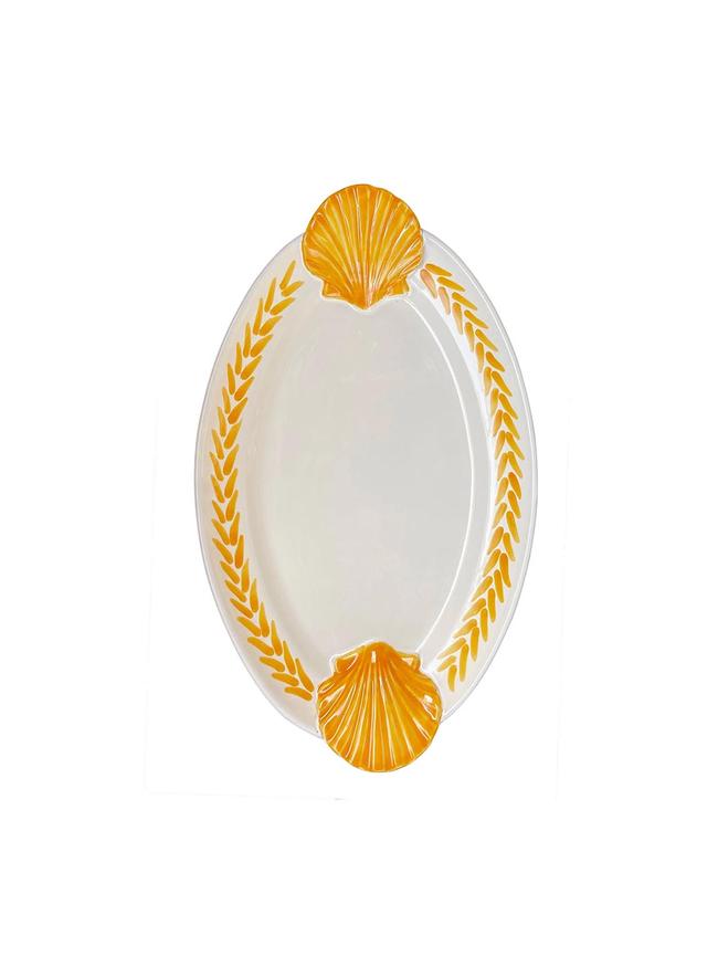 Alex and Trahanas scallop shell ceramic platter $340. <b>Shop now <a href="https://alexandtrahanas.com/" target="_blank">Alex and Trahanas</a></b>