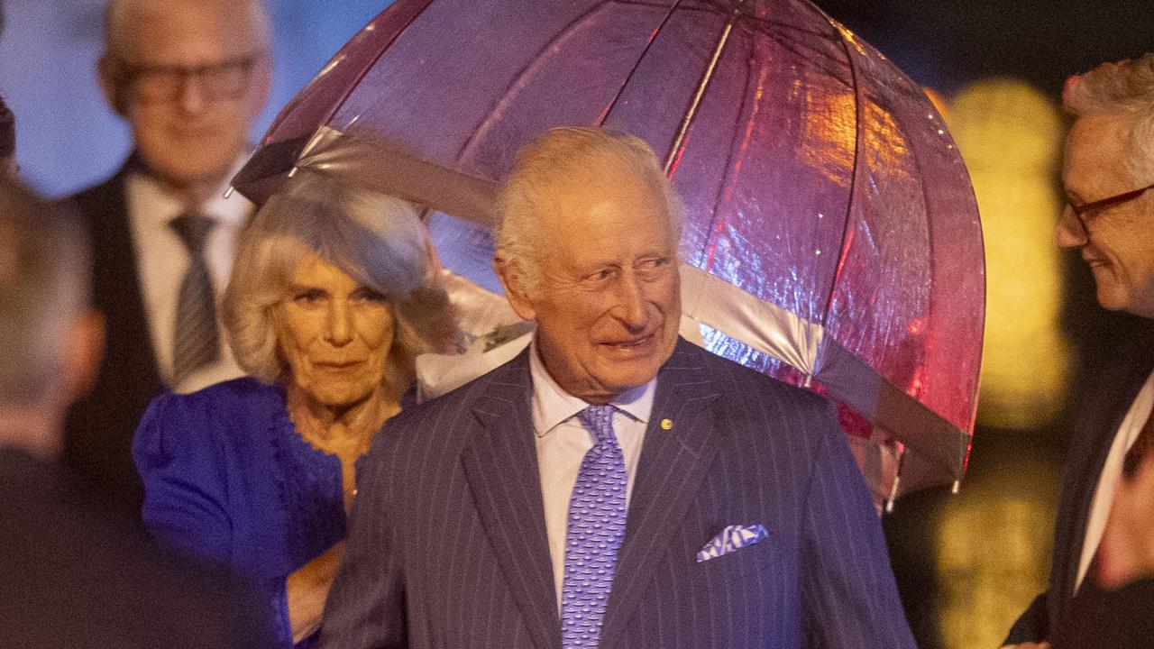 Rain spoils greeting as King and Queen touch down