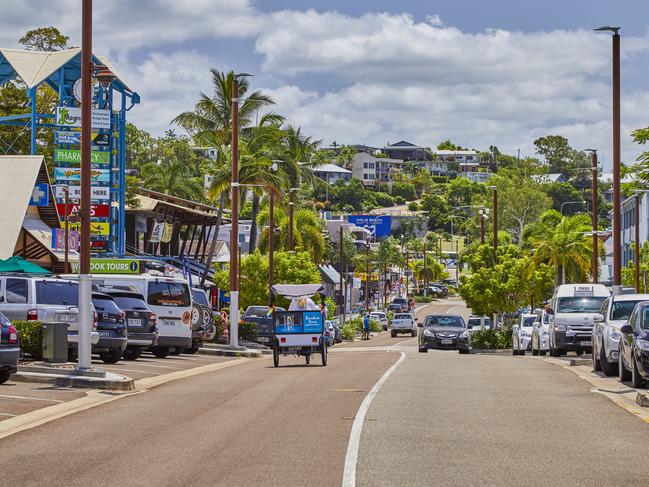 View of the Main street of the town of airlie Beach with shops,accomadation and cafes during daytime trading, Airlie Beach,Queensland,Australia.Escape 11 August 2024DestinationsPhoto - Getty Images