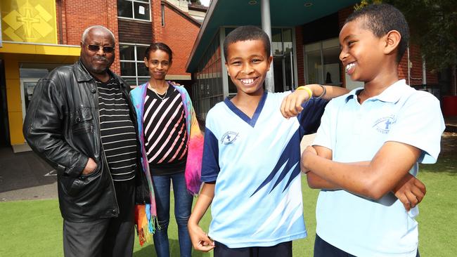 Dawet and Tomas Gebrehiwot at the Holy Rosary Primary School in Kensington with parents Gebreegziabher and Genet. Picture: <span class="creditattribution">Aaron Francis</span>