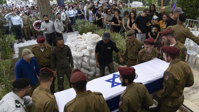 Soldiers carry the coffin during a funeral for Israeli soldier Sergeant Omer Ginzburg, 19, killed in a battle in Southern Gaza on August 13. Picture: Amir Levy/Getty Images