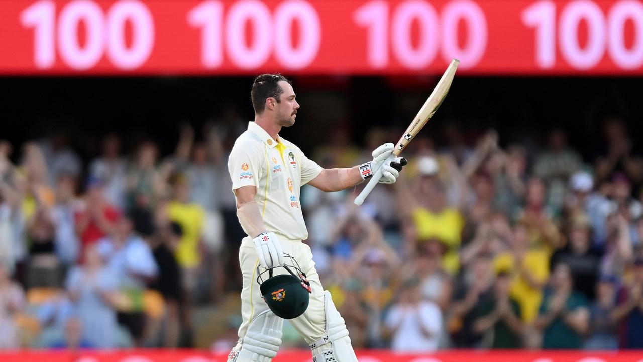 Travis Head raises his bat. Photo by Bradley Kanaris/Getty Images.