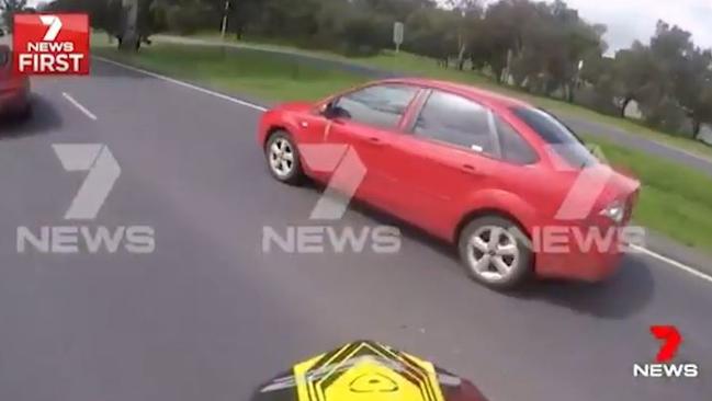 A still grab of the motorcyclist filming the motorist while chasing her along a busy road in Adelaide's northern suburbs. Picture: Seven News
