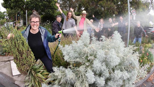 Emma Cutter with a lush nature strip garden. Picture: David Caird