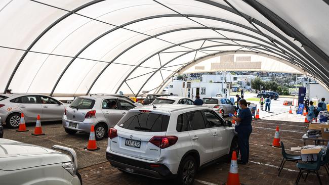 Insurers are more conservative when taking on new policies, noting the effects of Covid. Above, a Covid pop-up testing clinic in Sydney. Picture: NCA NewsWire / Flavio Brancaleone