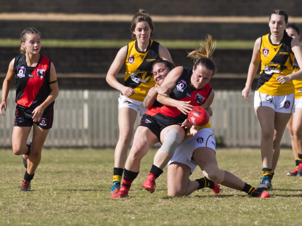 South Toowoomba Bombers player Amanda Leske tackled in the match against Toowoomba Tigers in AFL Darling Downs women round one at Rockville Oval, Saturday, July 11, 2020. Picture: Kevin Farmer