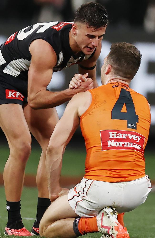 Daicos consoles Toby Greene after the final siren. Picture: Michael Klein