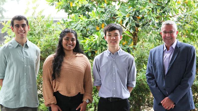 Marvin Madfouni, Mondira Paul and Josh Lim with St Paul’s principal Ian Wake.