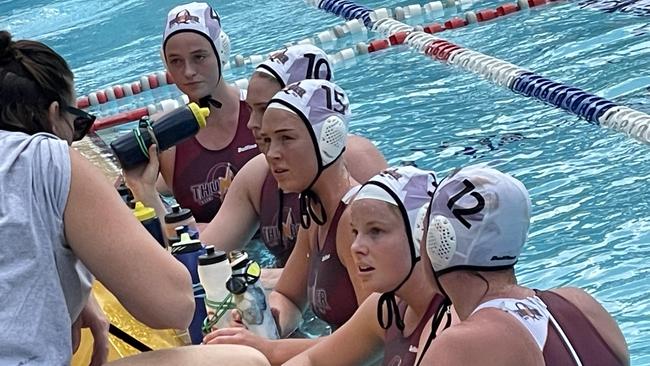 Queensland Thunder listen to coach Benn Lees.