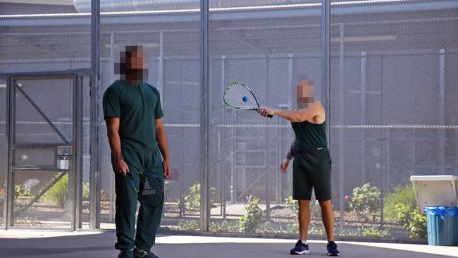 Prisoners play racquet ball in the experimental prison. Picture: Sam Ruttyn