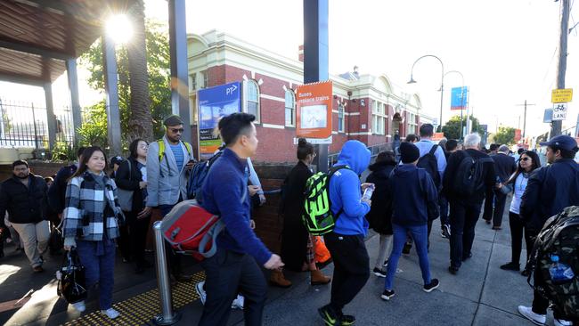 Commuters going from Caulfield station into the city have to catch buses during the major rail works. Picture: Andrew Henshaw