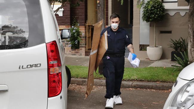 Forensic police at Karl Howard’s Annandale home where he is alleged to have lashed out with a samurai sword. Picture: Richard Dobson