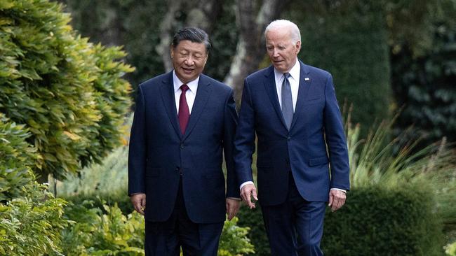 US President Joe Biden and Chinese President Xi Jinping walk together after a meeting during the Asia-Pacific Economic Cooperation (APEC) Leaders' week in Woodside, California. Picture: AFP.