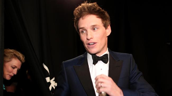 Best Actor winner Eddie Redmayne is seen backstage after winning his award.