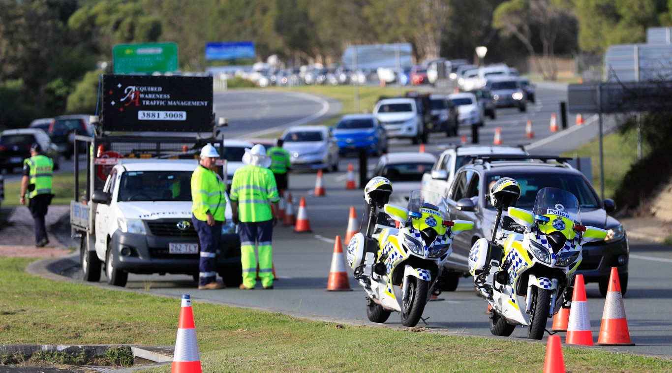 Traffic is backed up Kilometres on the Gold Coast Highway and M1 due to Queensland Police setting up a road blocks due to the Corona Virus at the NSW / Queensland Border on the old Pacific Highway at Coolangatta. Photo: Scott Powick Newscorp