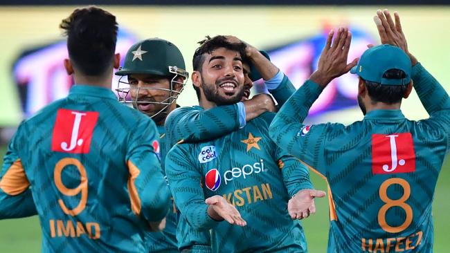 Pakistan players celebrate the big dismissal of Aussie star Chris Lynn.