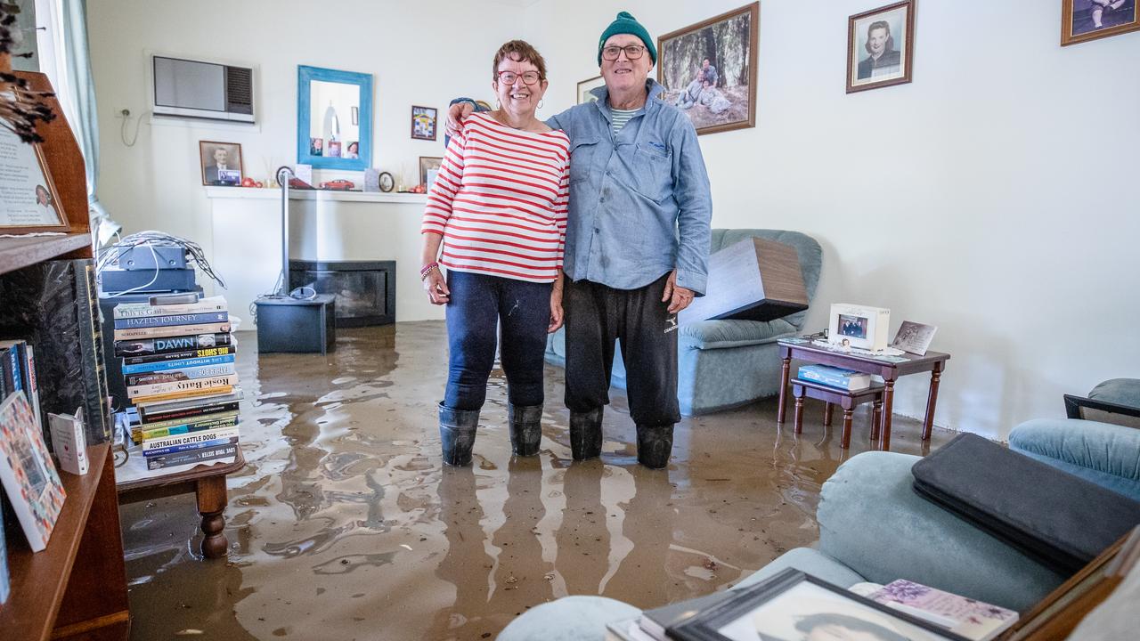 Glenys and Brian Mulcahy in their flooded Rochester home. Picture: Jason Edwards