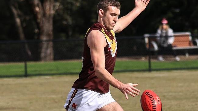 Ryan White gets a kick away for Boronia. Picture: Davis Harrigan