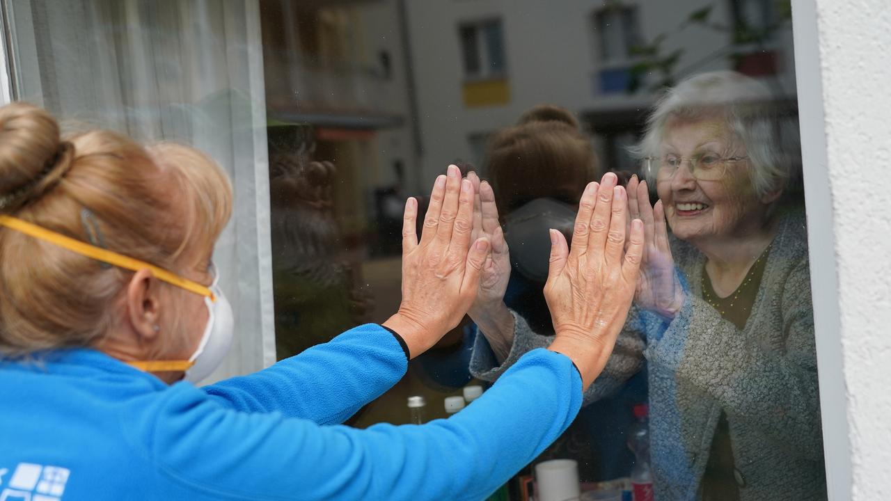 Resident Waltrud Bornschein, 90, and caregiver Marine Lehmberg, in Berlin, Germany. Picture: Sean Gallup/Getty Images)