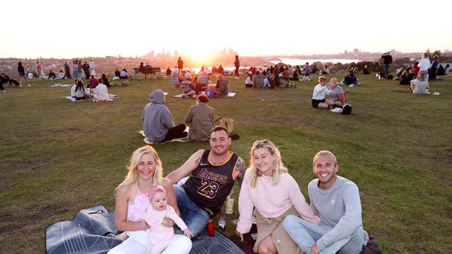 (L-R) Samantha Herring with her daughter Penny (5 months) Michael Meads, Lydia Oxley and Arran Lomas at Dudley Page Reserve in Dover Heights in Sydney's Eastern Suburbs. Picture: Damian Shaw