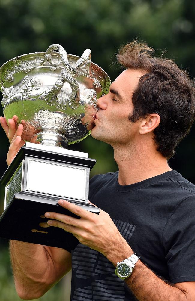 Fabulous Federer with the Australia Open trophy. Picture: AFP PHOTO/Saeed Khan