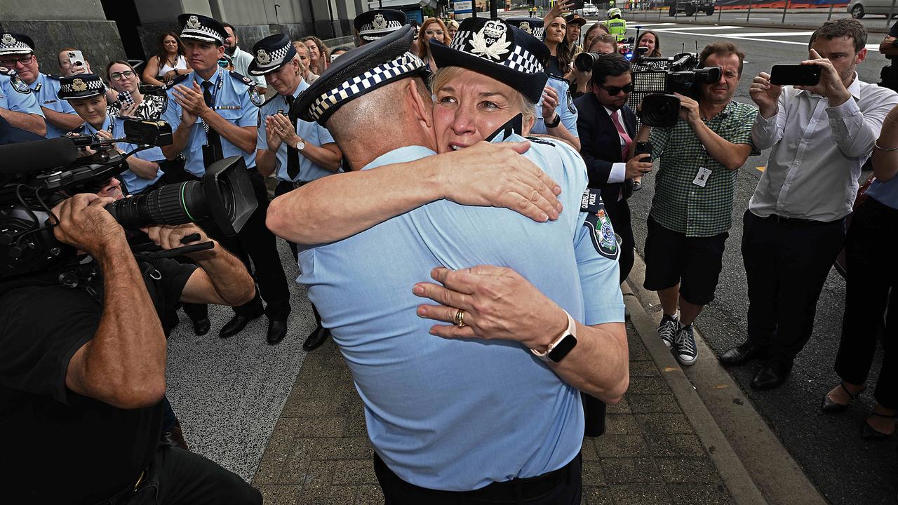 An emotional Commissioner Katarina Carroll being farewelled by current acting Commissioner Steve Gollschewski. Pic: Lyndon Mechielsen/Courier Mail