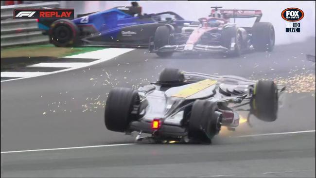 Zhou Guanyu’s car flipped and flew over the barrier. Picture: Fox Sports