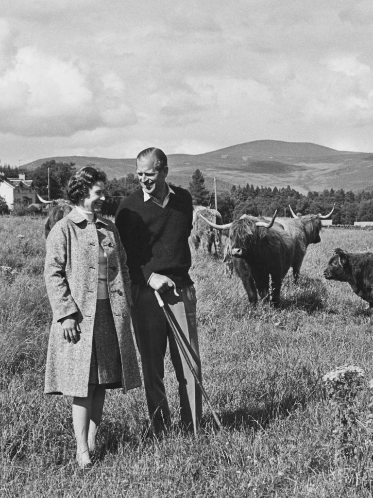 Queen Elizabeth II and Prince Philip in the grounds of Balmoral Castle in Aberdeenshire, Scotland. Picture: Fox Photos/Getty Images