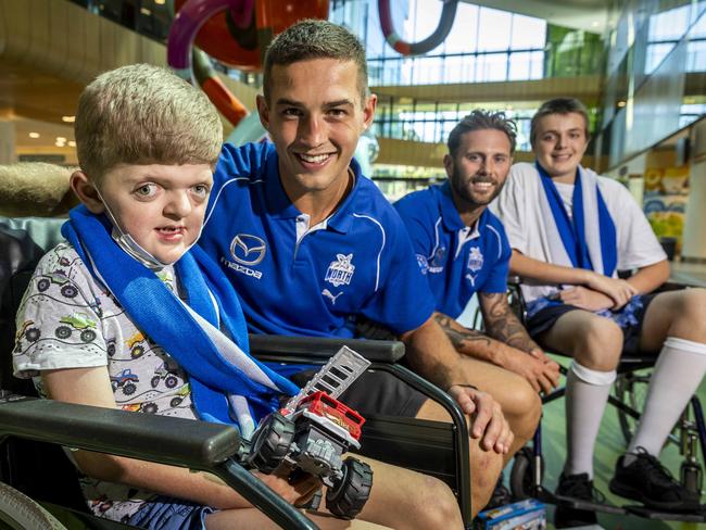 Will Phillips and Caleb Daniel meet patients Ronan Foot-Connolly (7) and Hamish Reid (14). Picture: Jake Nowakowski